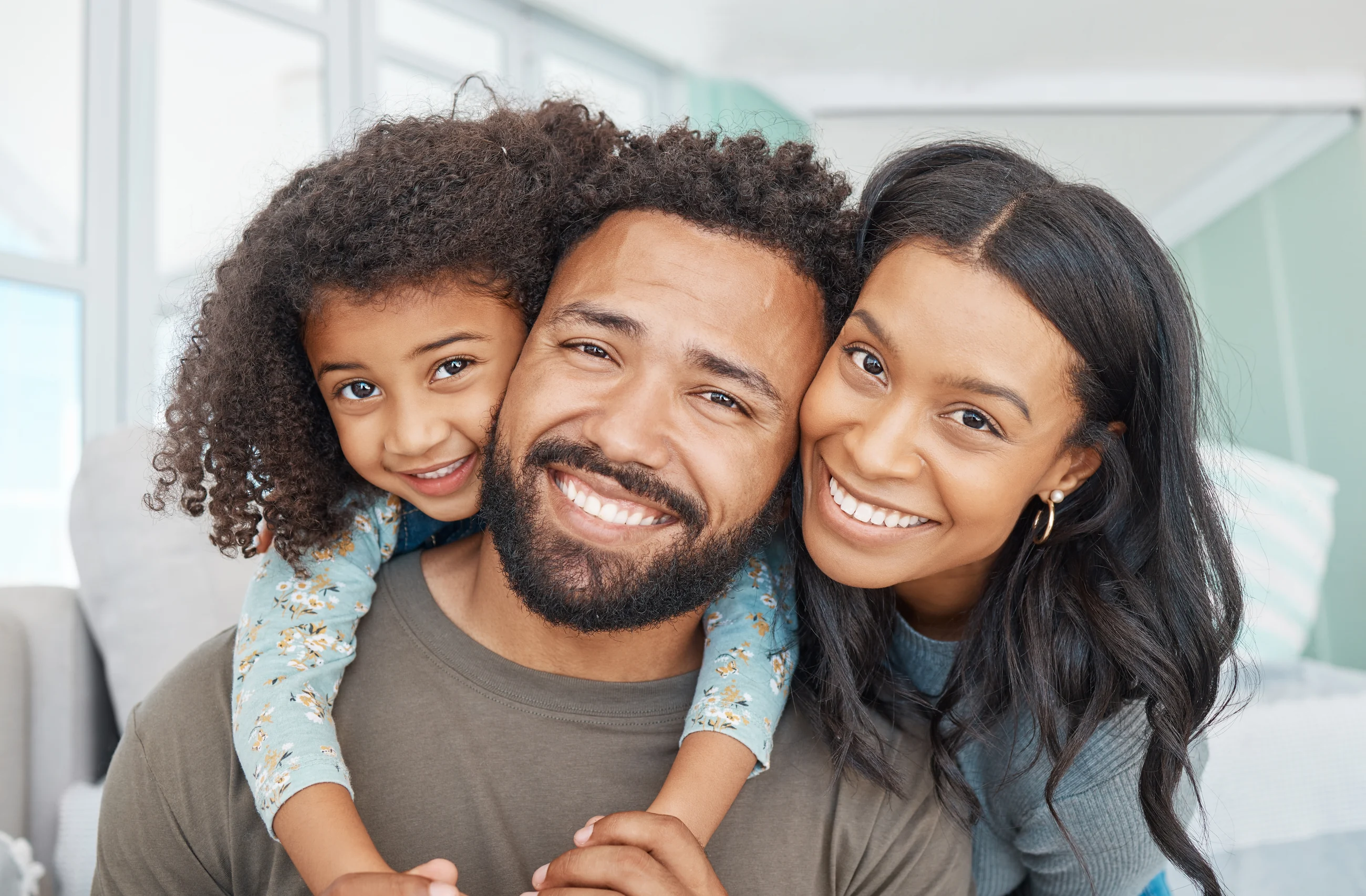 Family smiling close together