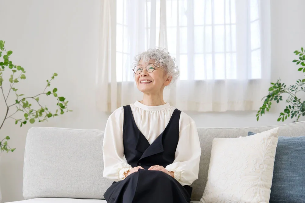 Smiling Patient Smiling older woman sitting comfortably at home
